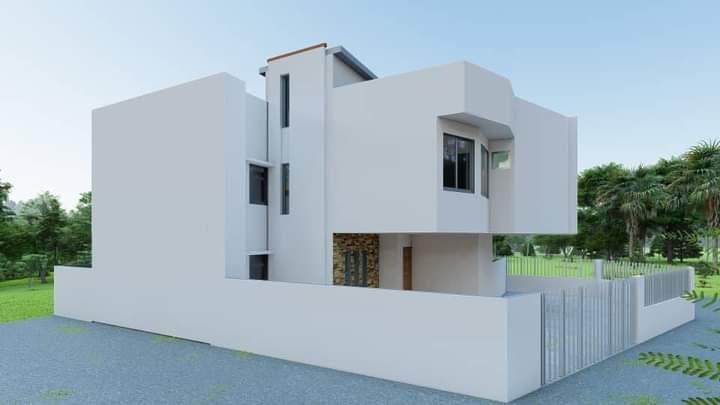 Vue arrière d'une villa contemporaine avec volumes superposés
